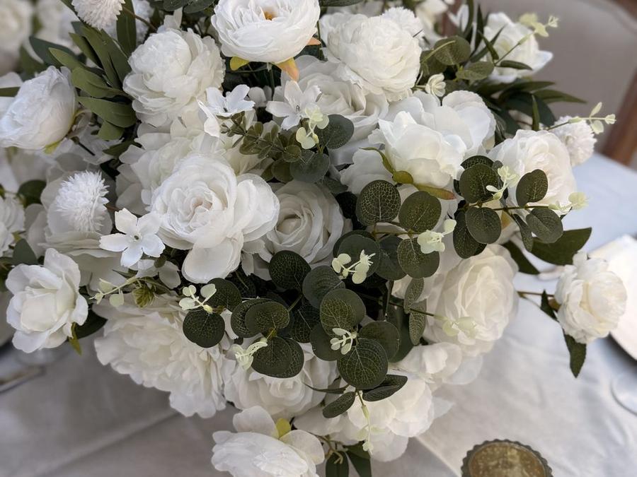 An ivory centrepiece seen low across the table linen