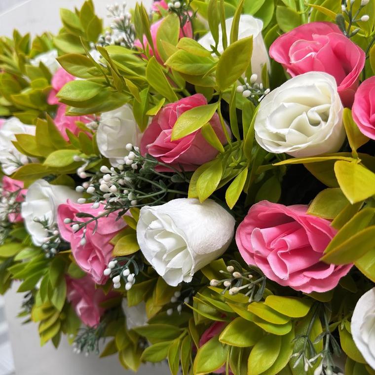 Pink and ivory roses with bright green foliage