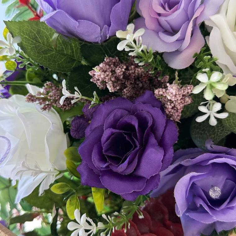 Purple and lilac roses with white blossom