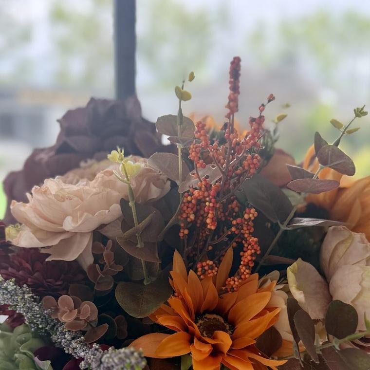 Rust, burgundy and burnt orange with a sunflower