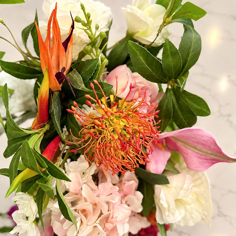 Orange protea, bird of paradise and magenta orchids